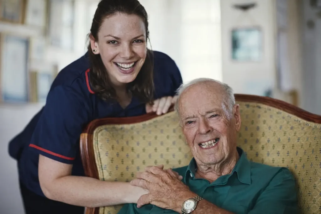 Nurse supporting elderly man with companionship and personalised care at home in Sussex and Surrey