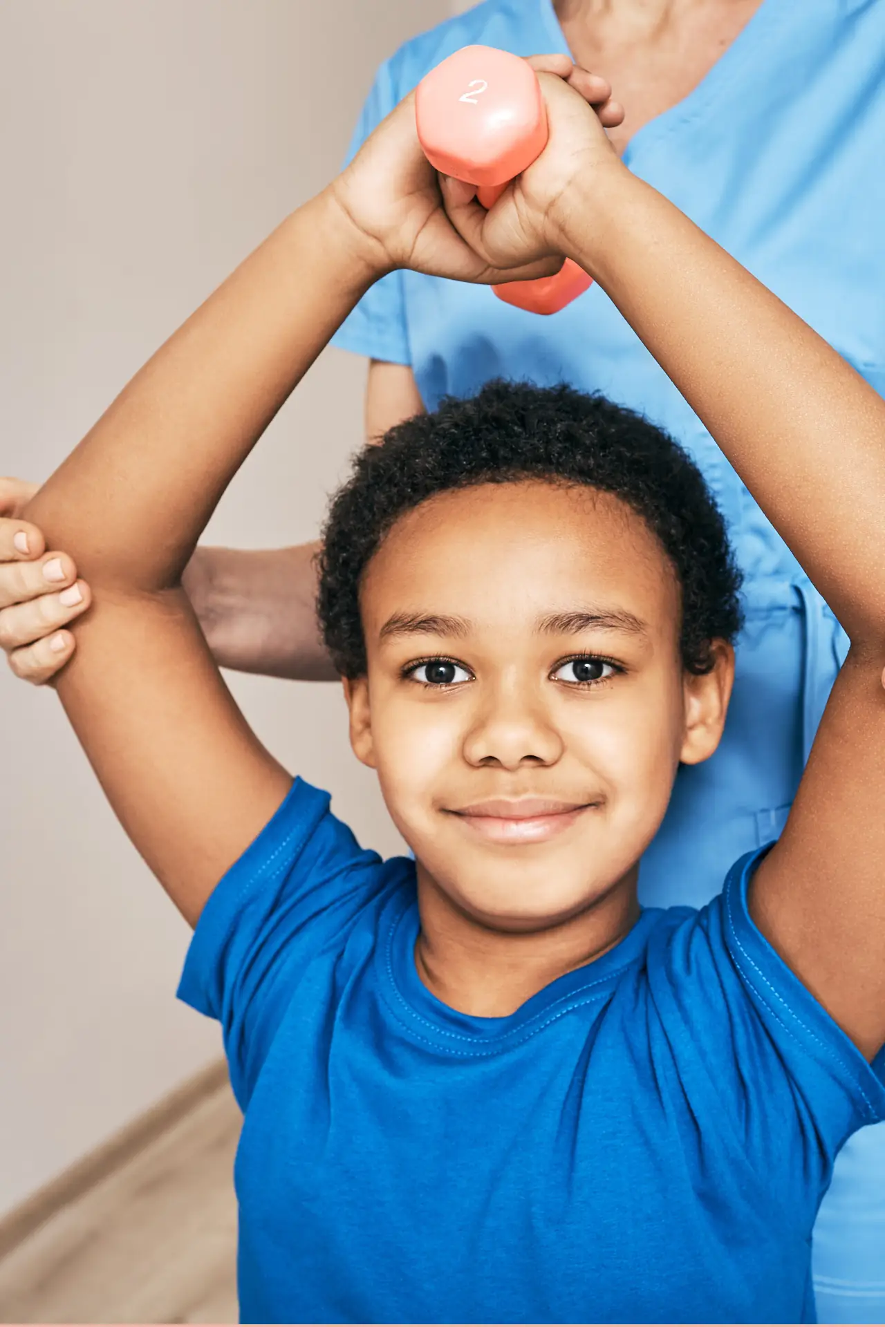 Child participating in guided physiotherapy exercises with professional support